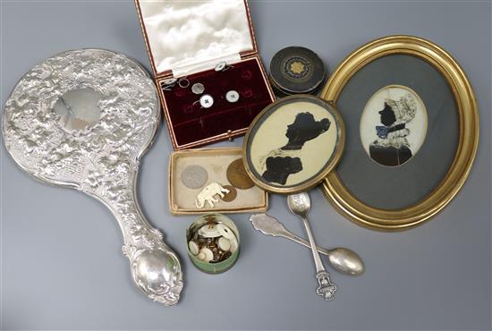 A silver-backed hand mirror, a Burmese pill box, silhouettes and sundries